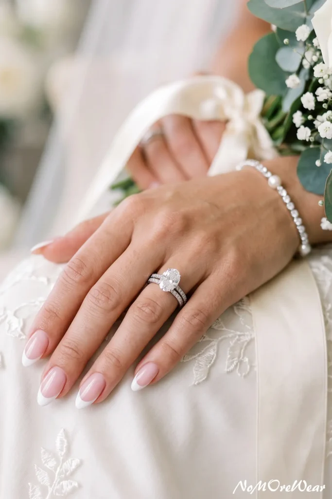 classic French wedding nail arts for women with soft pink base and white tips elegant bridal manicure