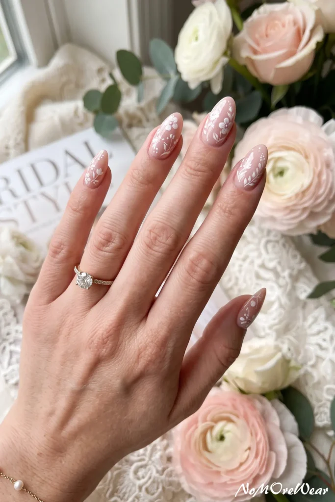 blush pink floral wedding nail arts for women with delicate flower details and romantic bridal style